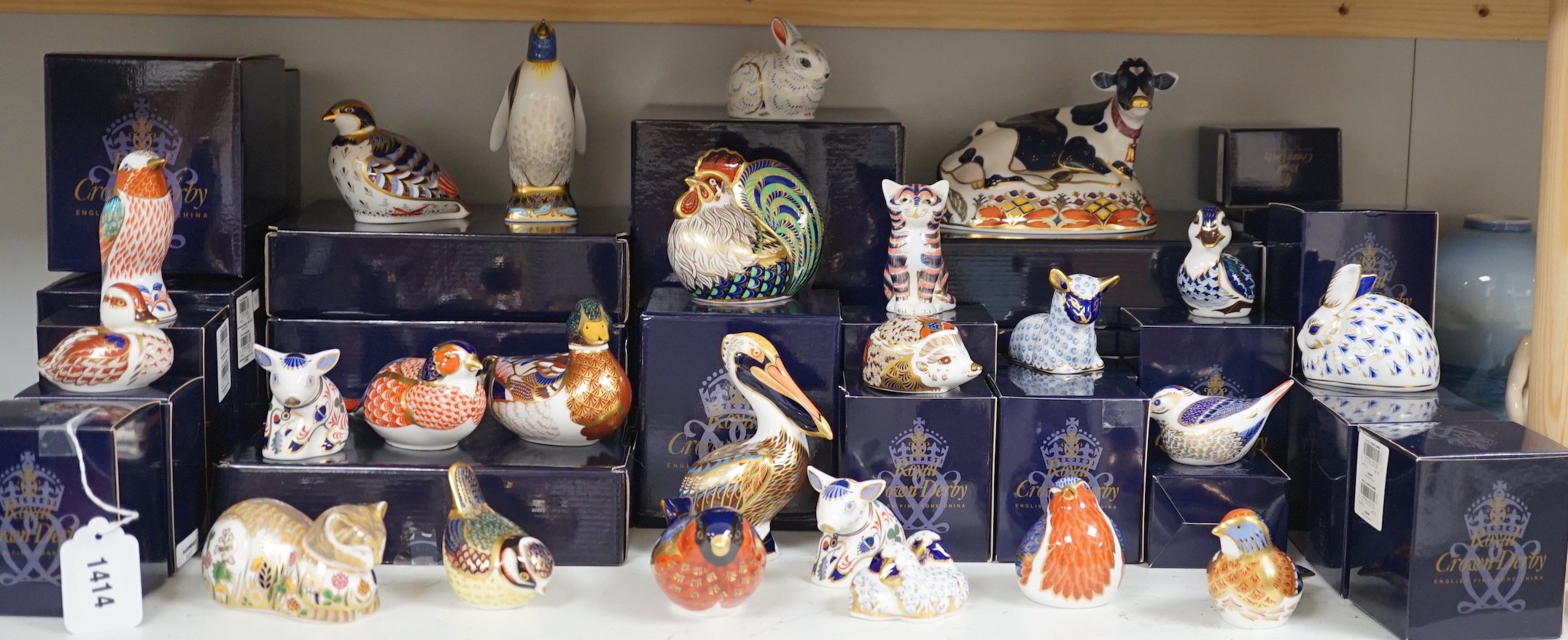 Approximately thirty-two Royal Crown Derby Imari porcelain paperweights, all but two with original boxes and mostly gold bottoms